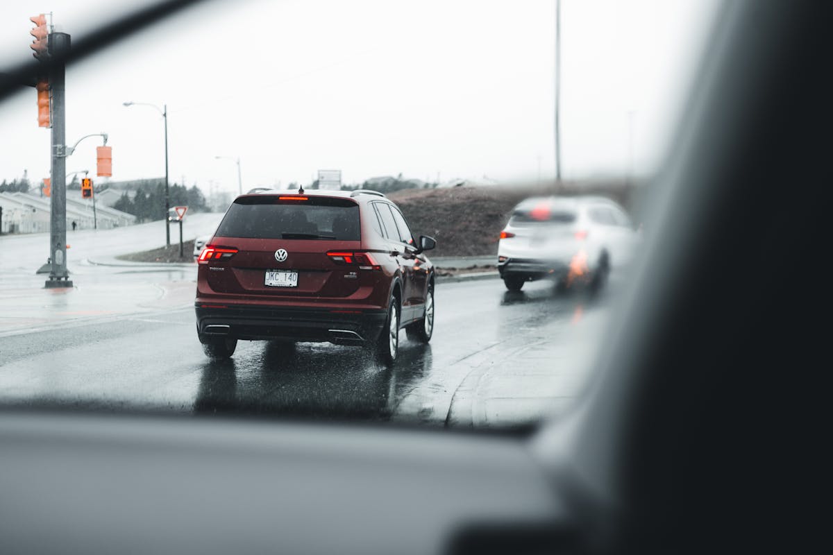 View of wet road through windscreen showing hazard awareness while driving